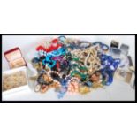 A collection of vintage costume jewellery to include pearl necklace, brooches, glass bead,