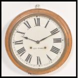 An early 20th Century Edwardian mahogany cased Station clock, the circular clock with Roman