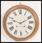 An early 20th Century Edwardian mahogany cased Station clock, the circular clock with Roman