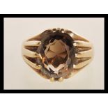 A hallmarked 9ct gold and smoky quartz ladies dress ring, weight 5.7g.
