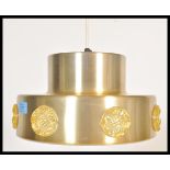A vintage retro 20th Century two step gold tone ceiling light fixture having applied plastic