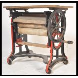 A vintage early 20th century Industrial Pioneer metamorphic mangle in pine and cast iron, the cast