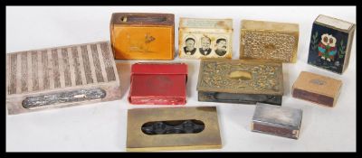 A collection of vintage early 29th Century match box covers and holders to include silver plated