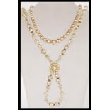 A vintage faux pearl graduated bead necklace having a platinum washed clasp complete in original box