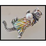 A stamped 925 plique a jour silver brooch / pendant in the form of a cat playing with a ball being