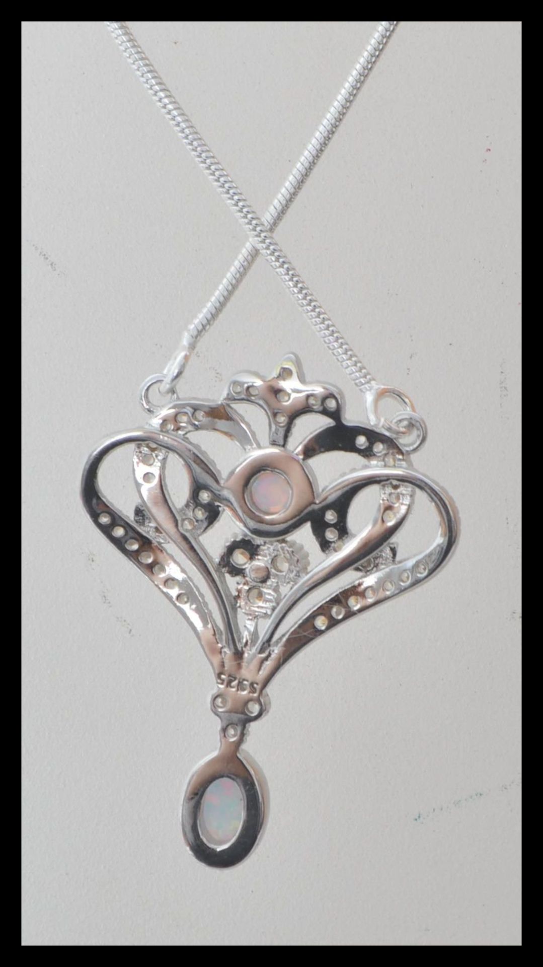 A stamped 925 silver necklace having an art nouveau style pendant set with cz's and opals, set to - Bild 2 aus 3