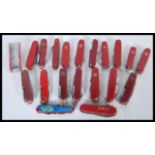 A collection of 20th Century pen knives / pocket knives to include a good selection of red Swiss