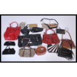 A quantity of vintage 20th Century ladies handbags of various designs to include tote bags, shoulder