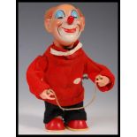 VINTAGE CLOCKWORK MECHANICAL WIND UP SMILING CLOWN TOY