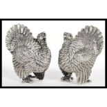 A rare pair of early 20th Century silver plated novelty salt and pepper pots or pepperettes in the