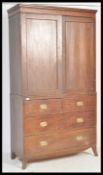 A Georgian 19th century mahogany linen press / wardrobe over chest of drawers. Bracket feet