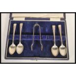 A set of four early 20th Century silver hallmarked Joseph Rogers & Sons teaspoons and a set of sugar