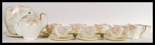 A 20th Century Wellington fine English bone china tea service consisting of six cup saucer side