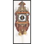 A 20th Century Dutch oak lantern-type Zaanse wall clock, marked around the fret mounts 'Nu Elck
