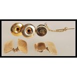 A 20th Century gentleman's lot consisting of a pair of stamped 9ct gold cufflinks, two stamped 9ct