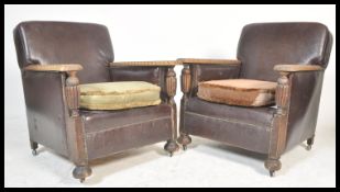 A pair of 20th Century 1930's Art Deco oak and faux leather fireside armchairs / arm chairs having