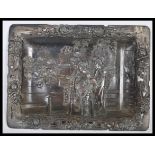 A Japanese bronzed tray, fret pierced border decorated with flowers having a central panel of