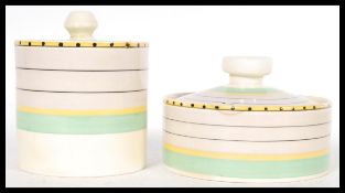 Two vintage 20th Century Art Deco Clarice Cliff porcelain condiments pots or jars of cylindrical