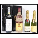 A group of wine and champagne to include two boxed Rioja Siglo wines, Moet and Chandon half bottle