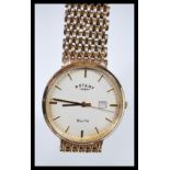 A boxed Rotary Elite 9ct gold gents watch set to a 9ct gold mesh watch bracelet strap. The white