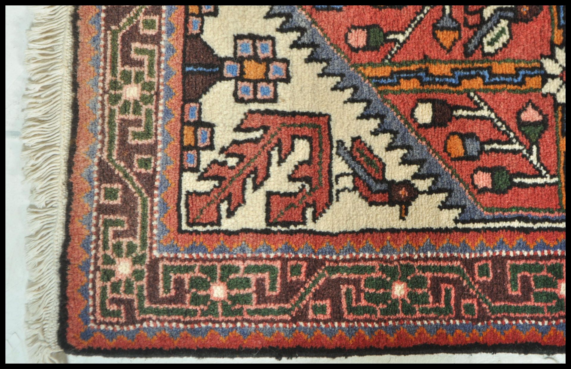 A 20th Century Persian carpet floor rug having a red ground with central tree of life panel and - Bild 3 aus 4