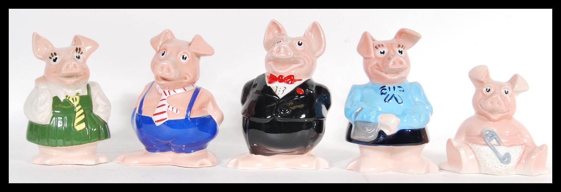 A group of five retro 20th Century Wade Natwest piggy banks with there original Natwest stoppers.