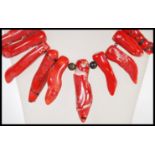 A large red coral festoon collar necklace with large white metal spring hoop clasp. Measures 48cm