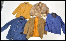 A selection of gentleman's coats to include a Barbour mustard quilted jacket having a corduroy