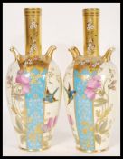 A pair of 19th Century French unidentified Limoges factory porcelain vases having an ivory blush