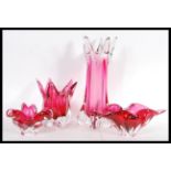 A set of four 20th Century Murano Sommerso studio art glass pieces in cranberry colourways