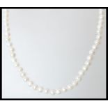 A fresh water pearl strung necklace having a silver catch clasp. Measures 46 cm total length.