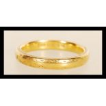 A hallmarked 22ct gold band ring. Hallmarked Birmingham 1940. Weight 5.5g. Size O.