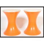 A pair of vintage 1960's Habitat Tam Tam stools in a two tone colourway, the inverted body of the
