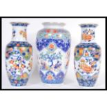 A 20th Century Chinese bulbous vase decorated with musicians and peonies throughout together with