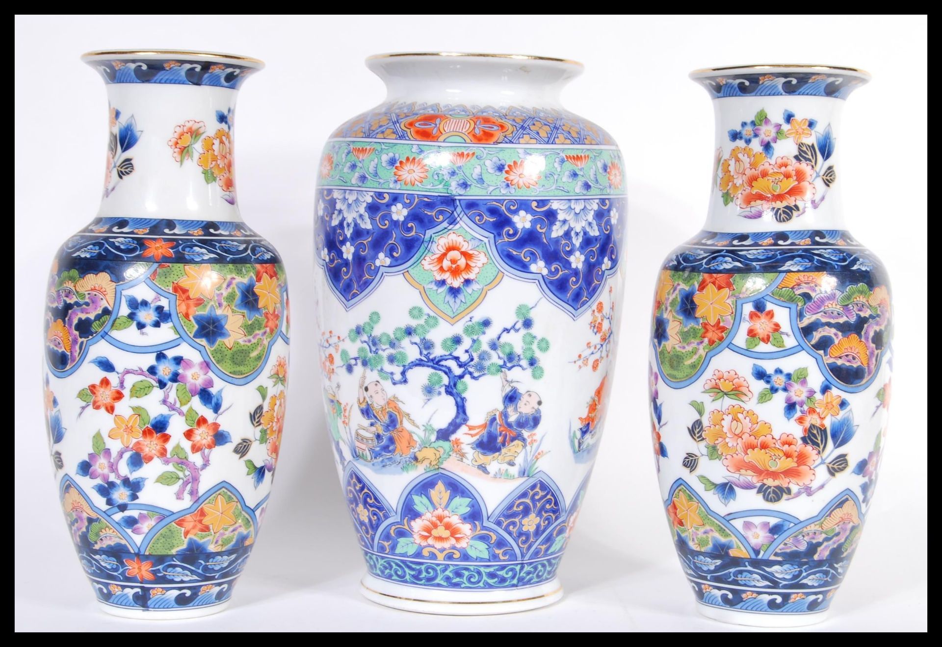 A 20th Century Chinese bulbous vase decorated with musicians and peonies throughout together with
