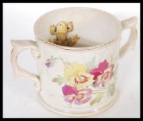 A 19th Century Victorian Staffordshire two twin handled loving cup mug surprise tankard having