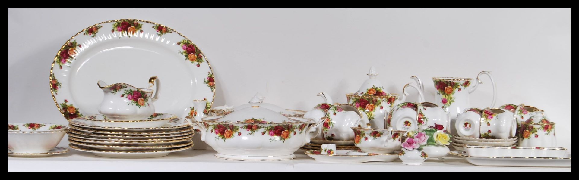 An extensive set of Royal Albert Old Country Roses pattern tea service including tea pot, cups and