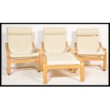 A set of three contemporary Ikea poang bentwood chairs / armchairs being upholstered loose