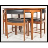 A.H. McIntosh Of Kirkcaldy - A mid 20th century retro vintage teak wood dining suite comprising of a