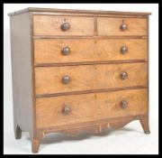 A Victorian 19th century flame mahogany 2 over 3 two tone chest of drawers being raised on french