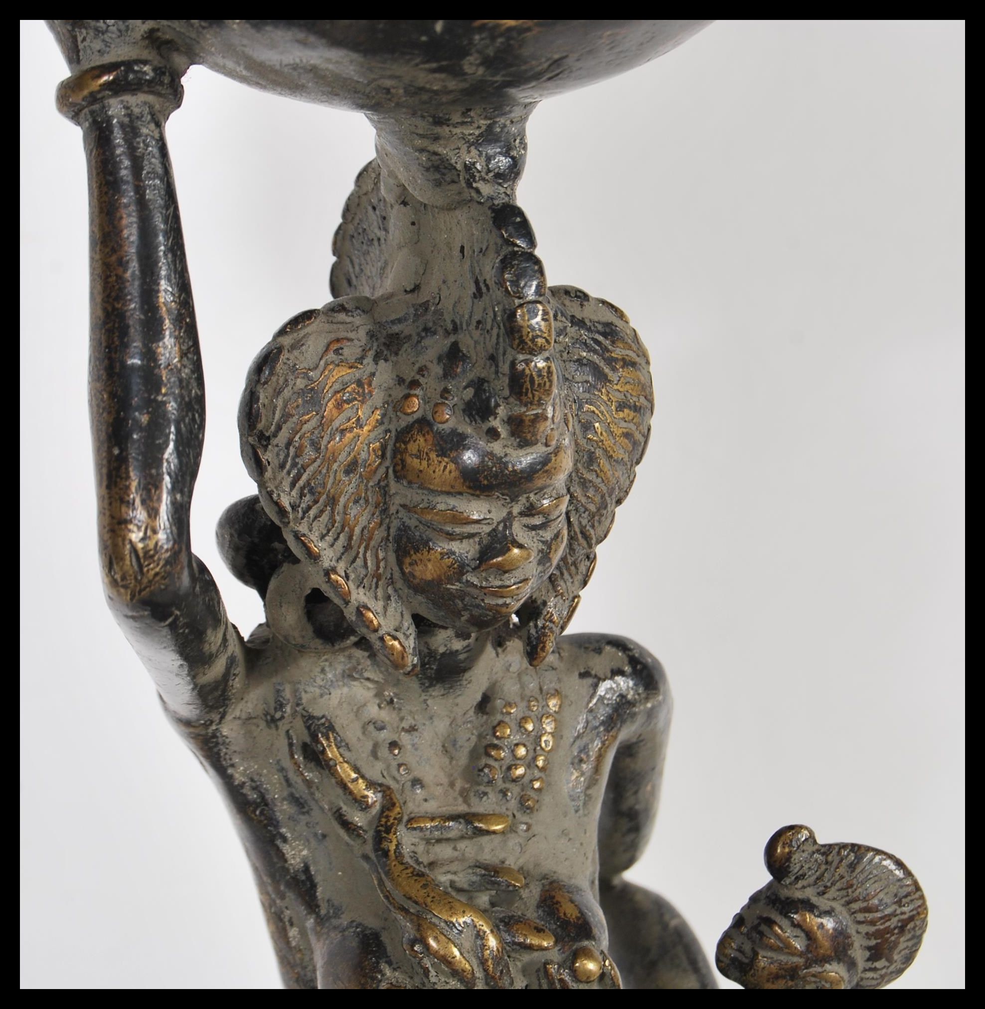 A 20th Century African fertility bronze figure, the figure raised on a circular base of a mother - Image 2 of 7