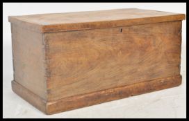 An early 19th Century Georgian elm blanket box steamer trunk coffer chest having a hinged lid with