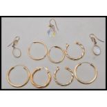 A group of 9ct gold earrings to include a opalescent moonstone set pair of drop earrings, pairs of