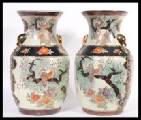 A pair of 20th Century large Japanese Satsuma vases  decorated with birds perching amongst trees, fu