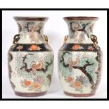 A pair of 20th Century large Japanese Satsuma vases  decorated with birds perching amongst trees, fu