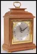 A 20th Century Elliot mantel clock retailed by Garrard & Co Ltd, having a silvered face with roman