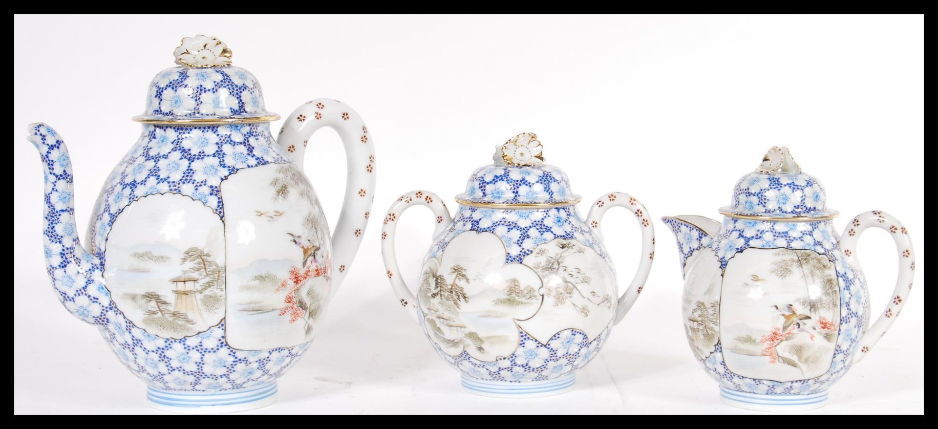 A 20th Century Japanese tea set consisting of hand painted cartouche tea pot, water jug and twin