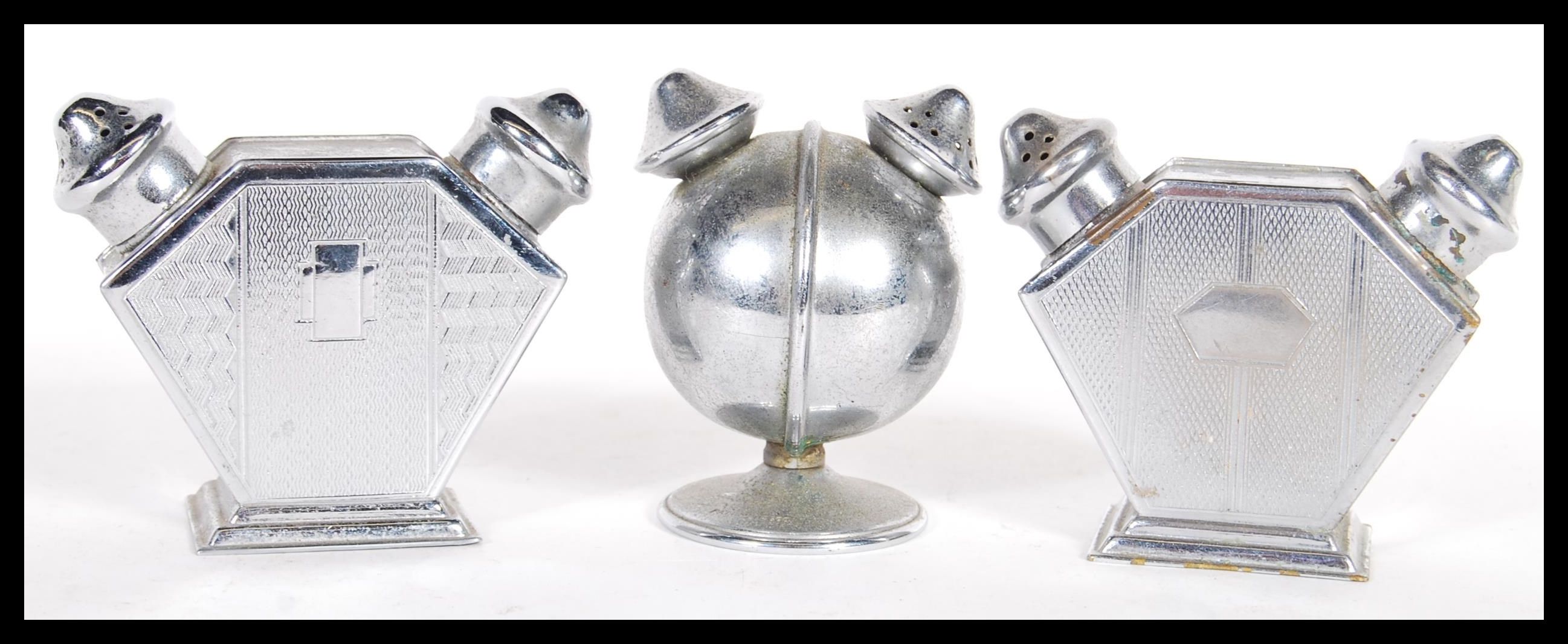 A group of three vintage early 20th Century art deco double dual condiment shakers consisting of a