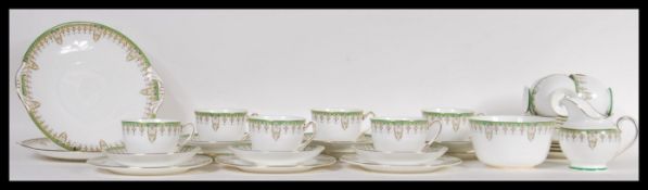 A 20th Century Royal Doulton tea service in the Tivoli pattern consisting of two large cake