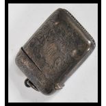 An early 20th Century hallmarked silver Edwardian vesta march case having engraved Armorial